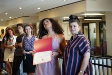 Student Holding Award